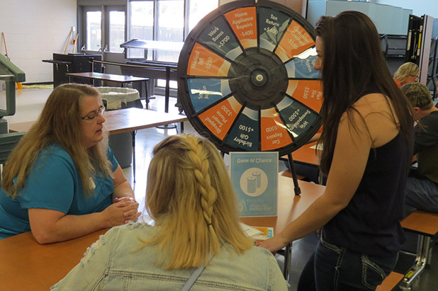 Spinning fortune wheel as part of financial reality fair day