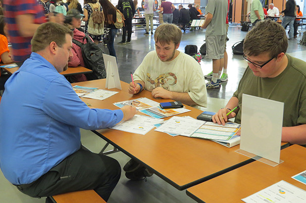Students reviewing financials as part of financial reality fair