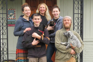 Family photo of mother, four children and dogs