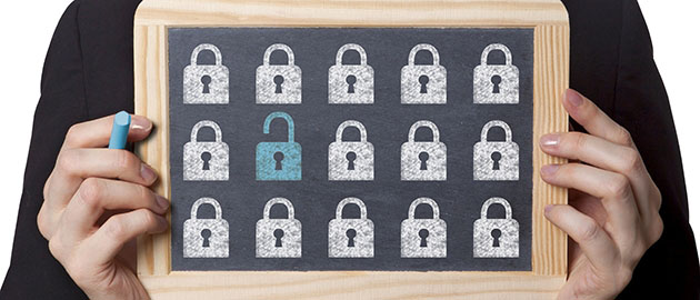 woman holding chalkboard sign with drawings of locks on it