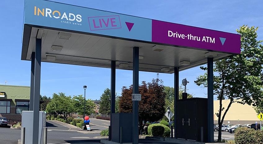 large awning with two drive thru vehicle lanes