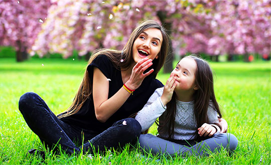 Girl with sister in field