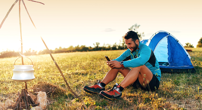 Using a smart phone in the mountain camp