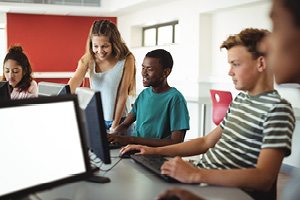 students using computer in classroom