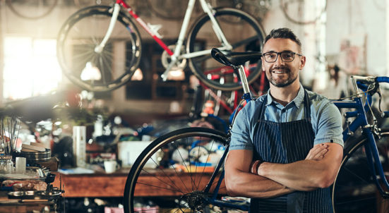 man in glasses bikes repair