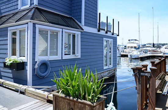 Victoria city Inner Harbor landscape. Village of colorful floating houses. Fisherman Wharf in Victoria, Vancouver Island, Canada