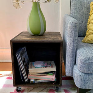 wooden box with wheels turned into a side table