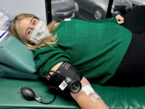 Addison Hiatt gives blood