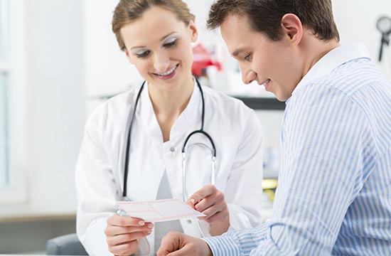 Female doctor with her patient in a consultation in clinic explaining something