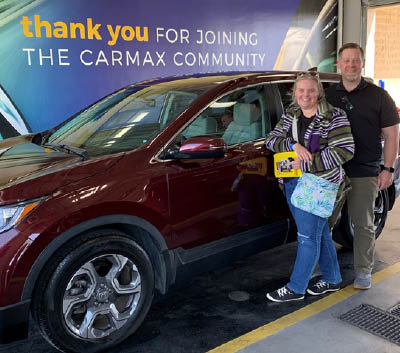 Member, Eric and his wife, posing with their new Honda from Car Max