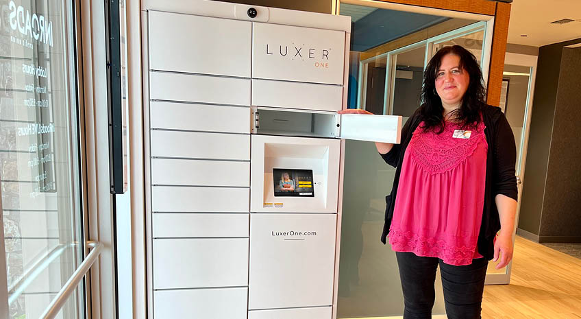 inroads employee jolee showing off the secure lockers at the scappoose inroads location