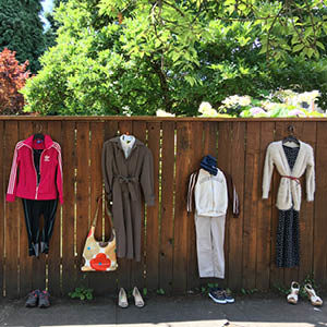 complete outfits with accessories from garage sale on display