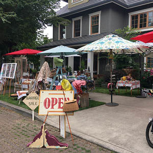 open sign at a yard sale, bright and colorful