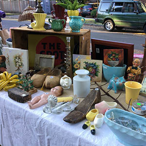 display of vintage items on a table at a yard sale