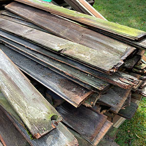 old fence boards sitting on grass