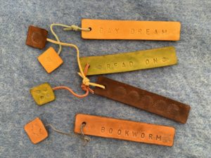 various colors of leather stamped bookmarks, DI, upcycled