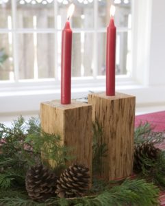 red candles in wood block candlesticks
