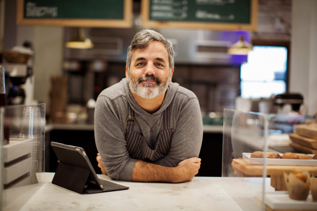 Business owner at register