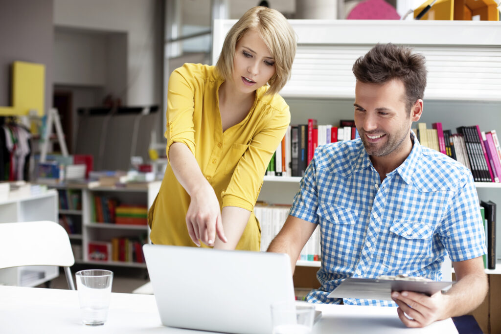Two business owners working on computer