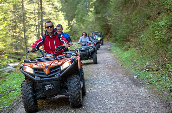 man riding atv vehicle on off road track ,people outdoor sport activitiies theme.