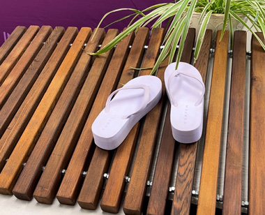 DIY wood slat door mat with purple sandals created by shannon quimby