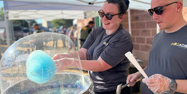InRoads employees Paige and Dallas volunteering to make cotton candy at National Night Out.