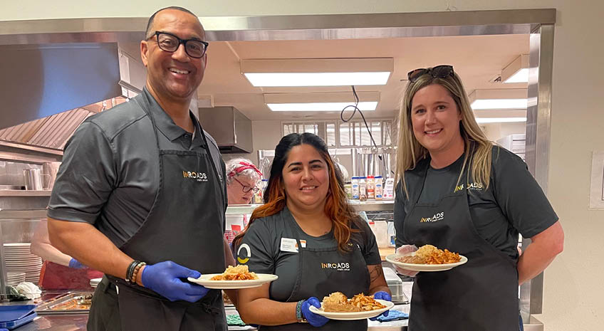 inroads employees serving meals to senior citizens