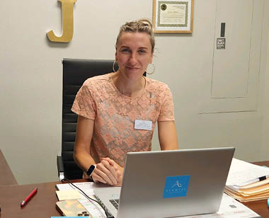 avamere st helens employee sitting at desk