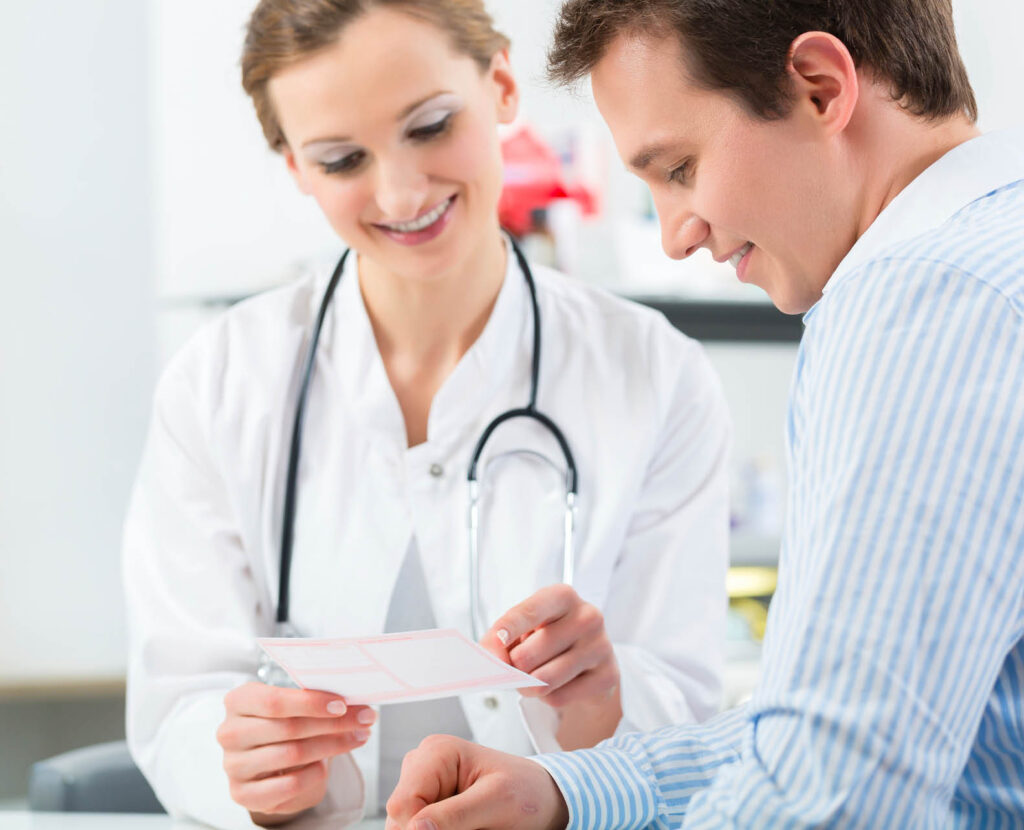 woman dr with stethoscope speaking to male patient