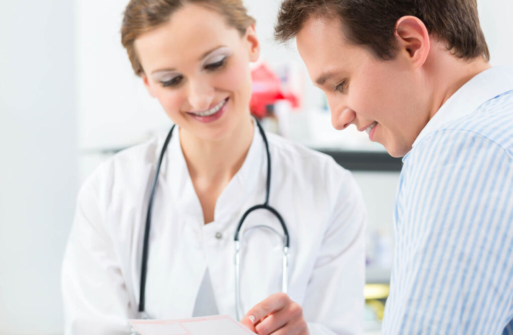 woman dr with stethoscope speaking to male patient