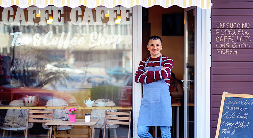 Businessman in front of cafe