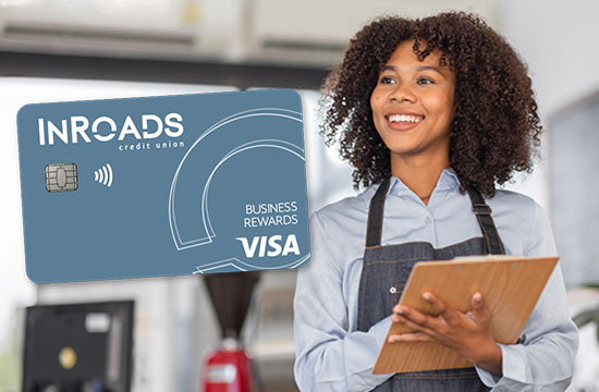 InRoads Business Rewards Visa credit card, female small business owner holding a clipboard and smiling
